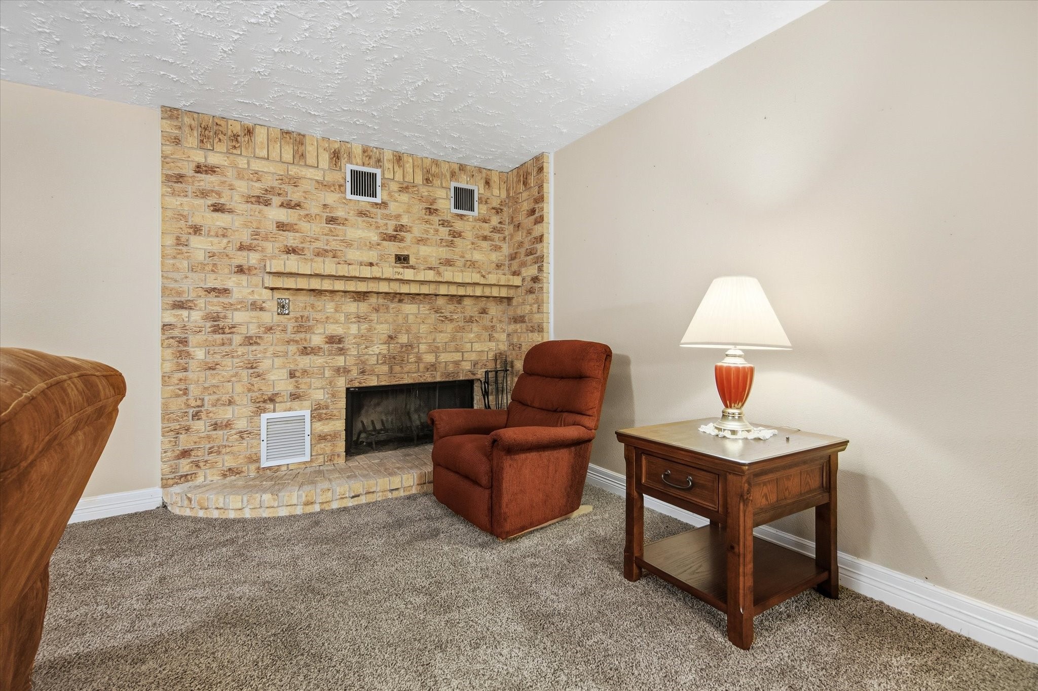 411 County Road 2298 Cleveland, TX 77327 - Photo 9 of 47 a living room with furniture and a fireplace