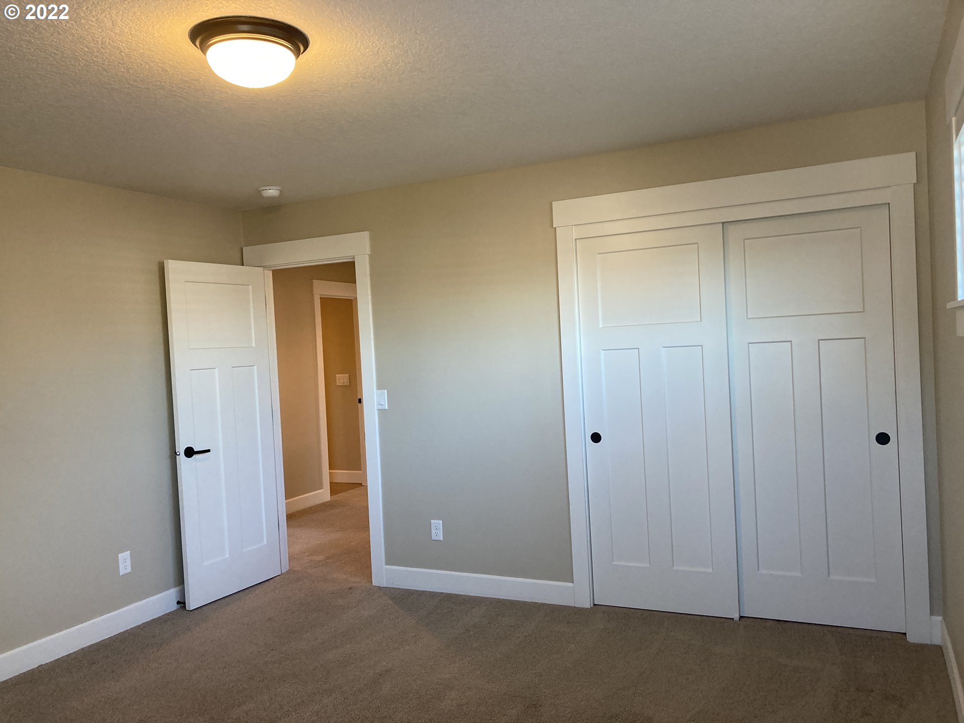 1201 South Quail Run Place Ridgefield, WA 98642 - Photo 18 of 27 an empty room with closet area