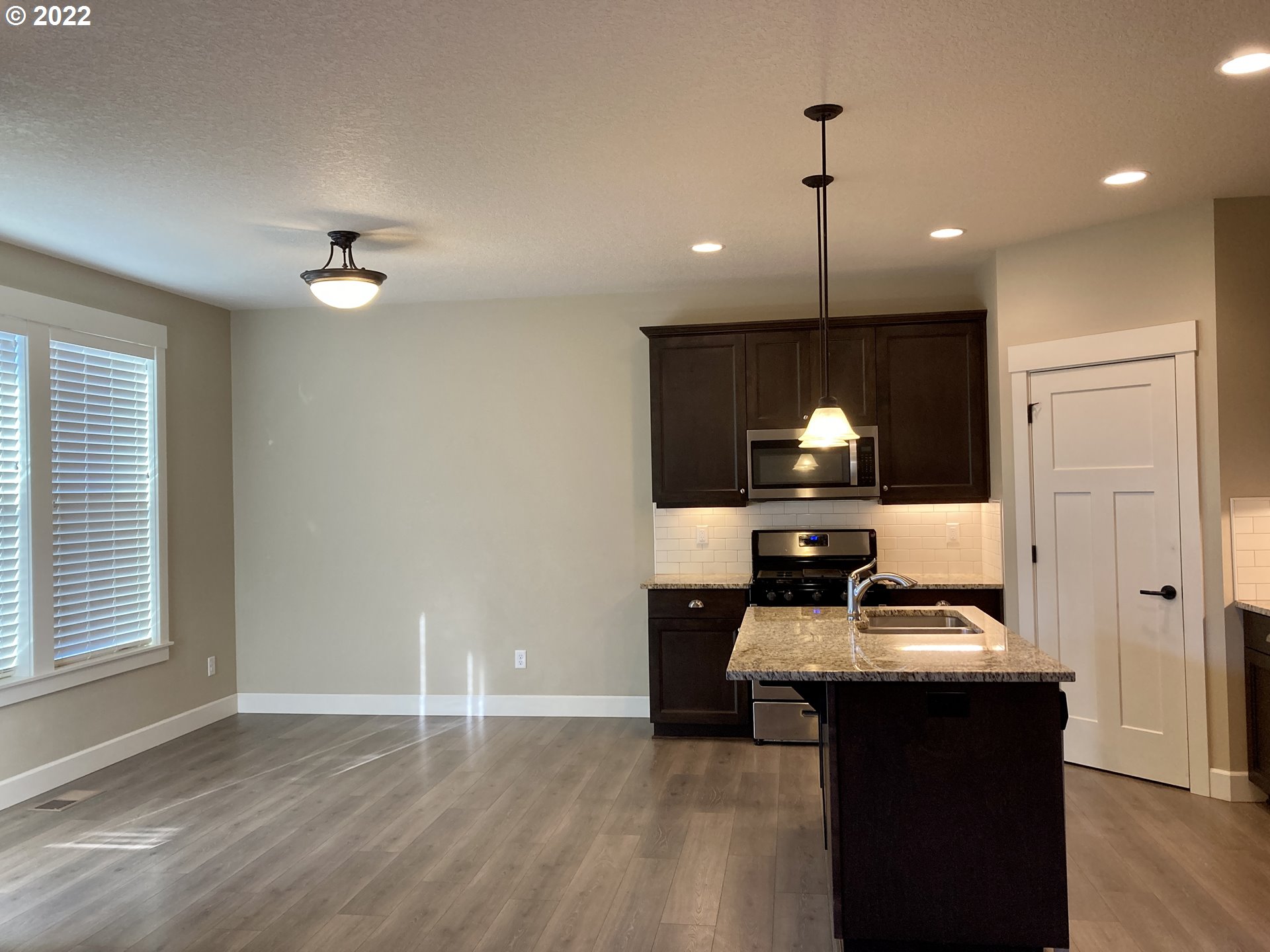1201 South Quail Run Place Ridgefield, WA 98642 - Photo 6 of 27 a room with a table chairs and entryway