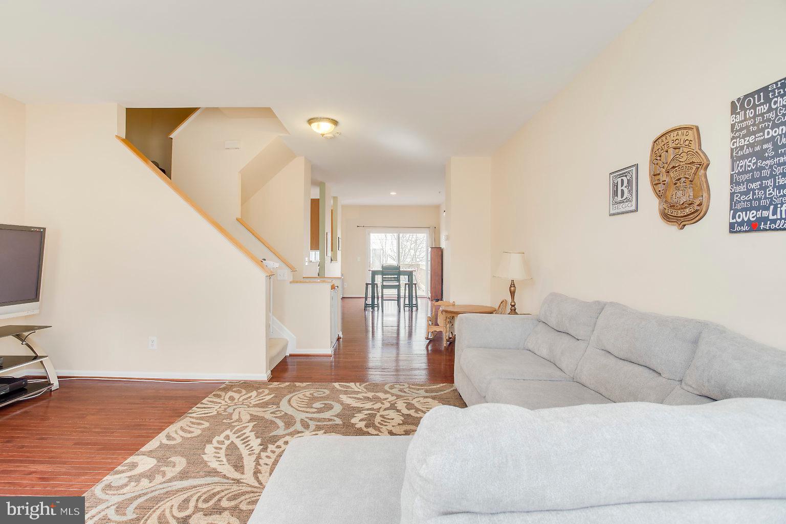 4032 Cutty Sark Road Baltimore, MD 21220 - Photo 18 of 34 Open Living Room/ Dining Room with Hardwood floors