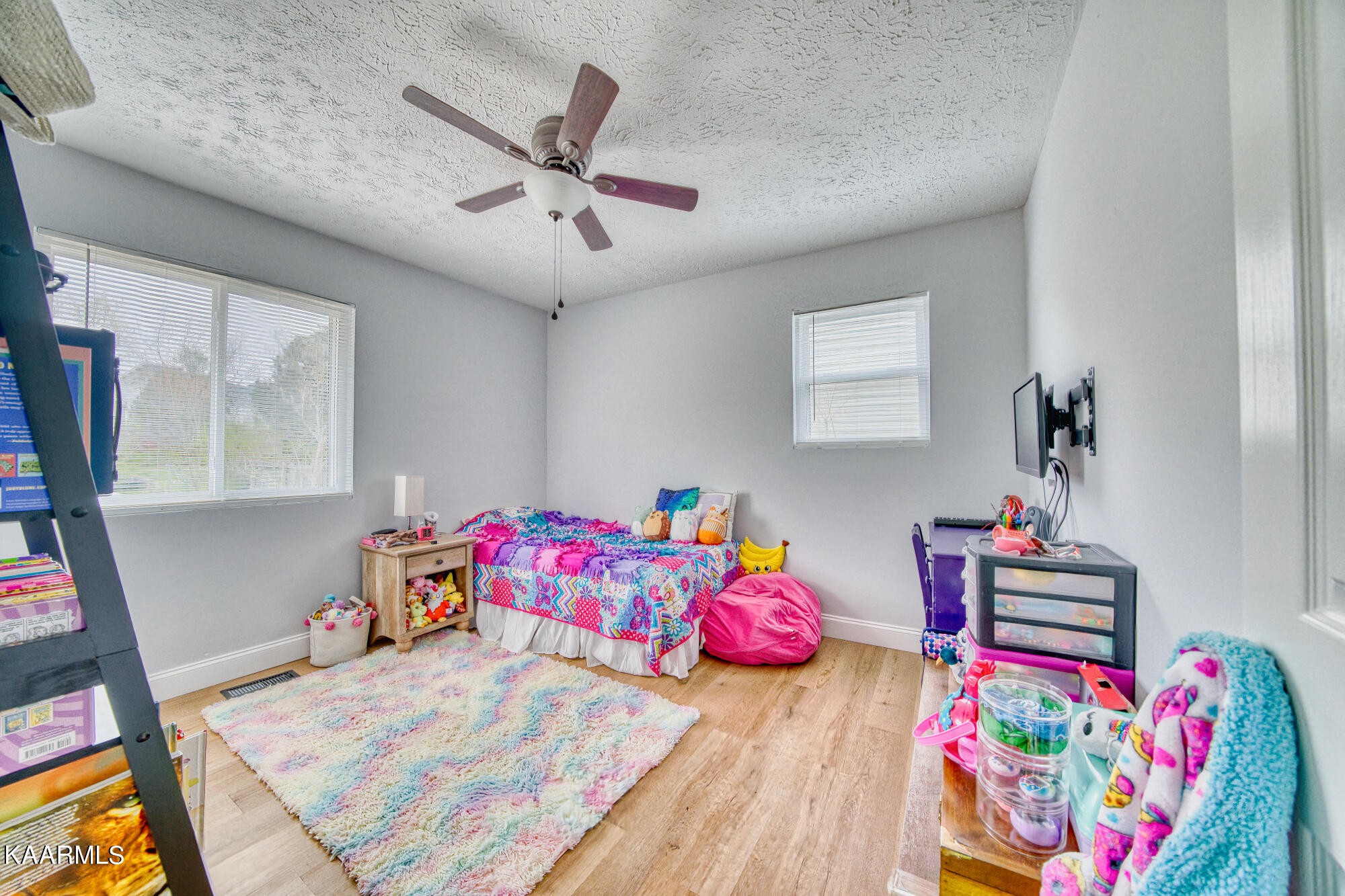 1519 Cunningham Road Knoxville, TN 37918 - Photo 11 of 16 a bedroom with a bed dresser and a window