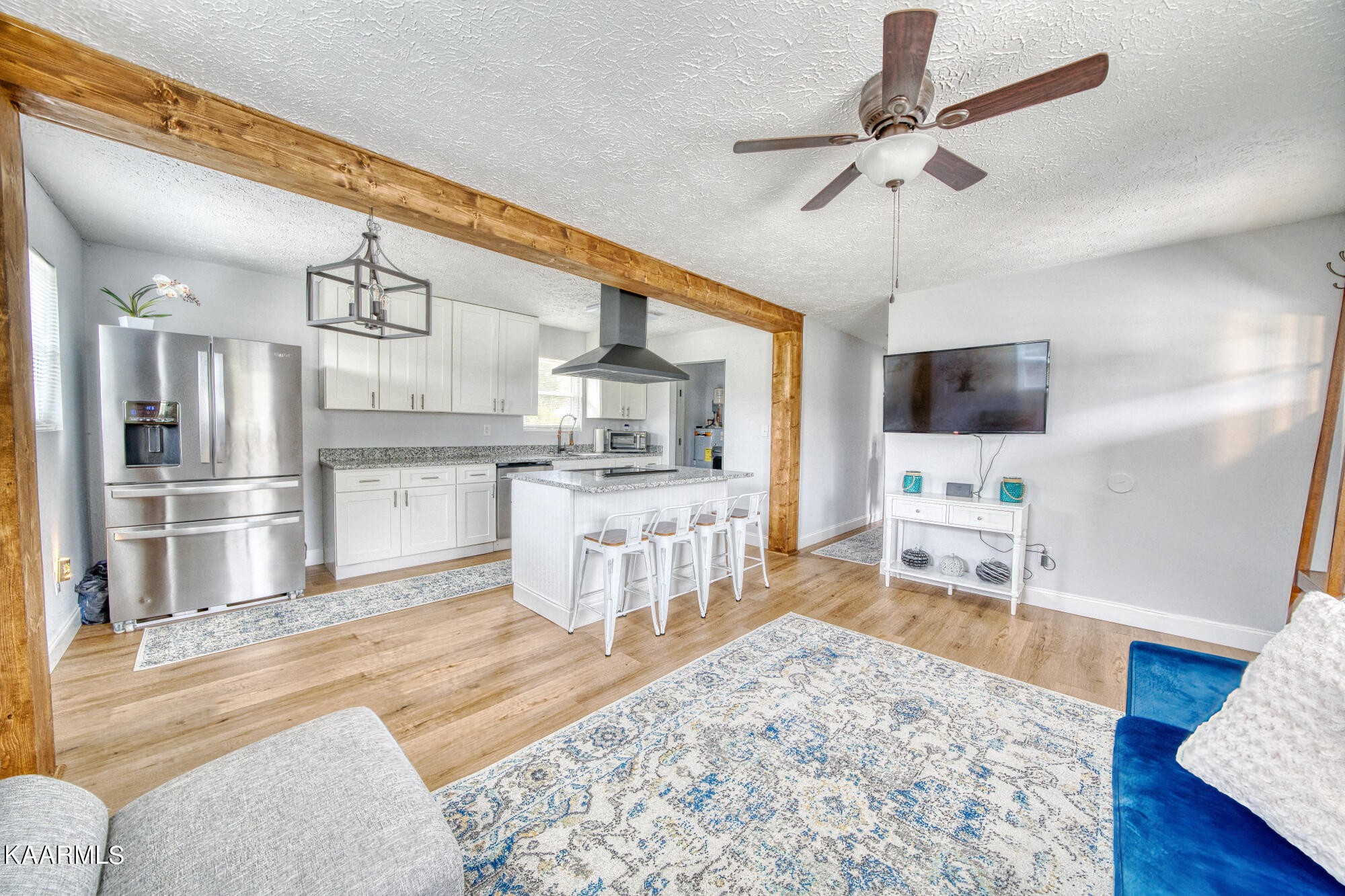 1519 Cunningham Road Knoxville, TN 37918 - Photo 4 of 16 a living room with stainless steel appliances kitchen island granite countertop furniture and a kitchen view