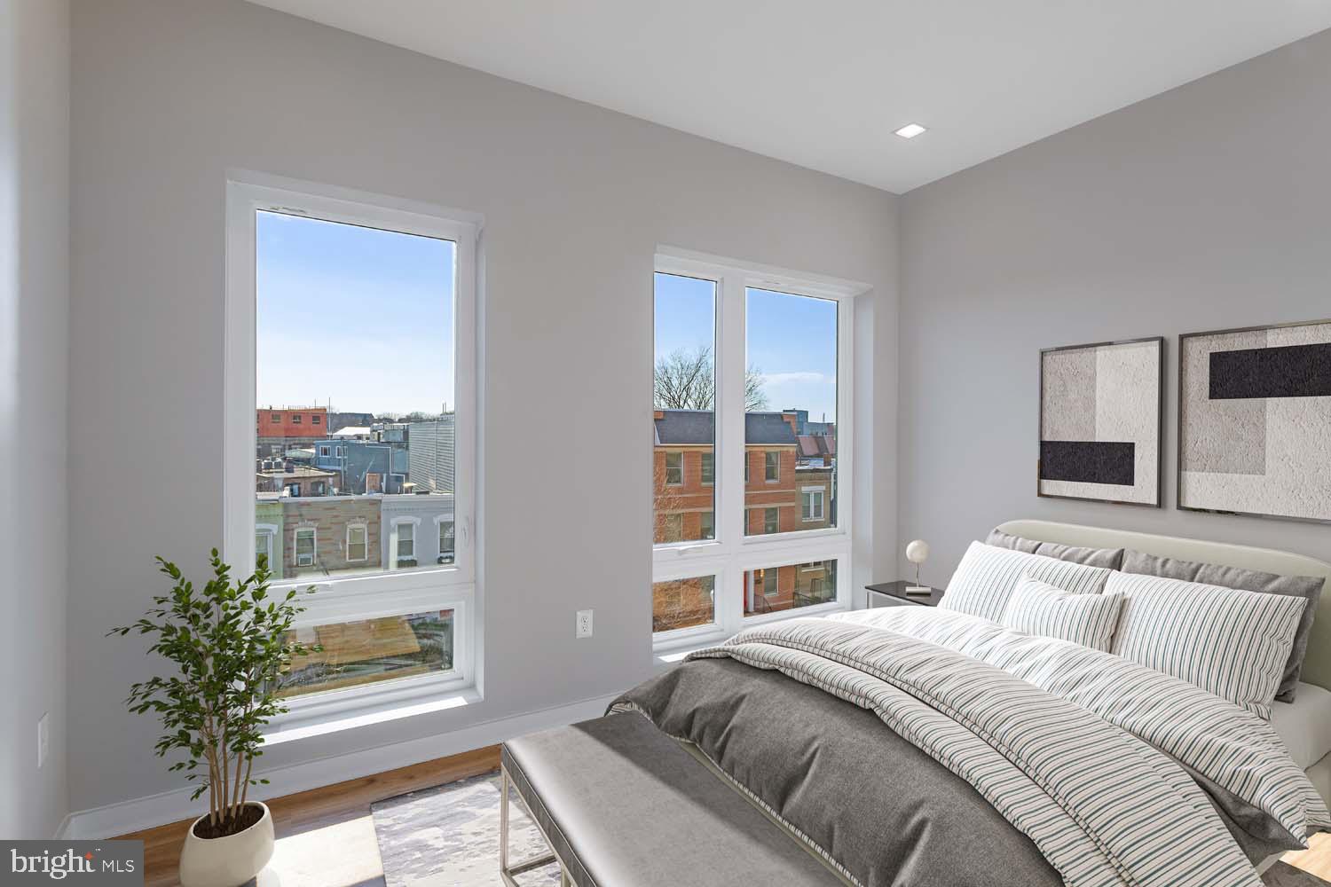 1358 Florida Avenue Northeast, Unit 207 Washington, DC 20002 - Photo 4 of 15 a bedroom with a large bed and a large window