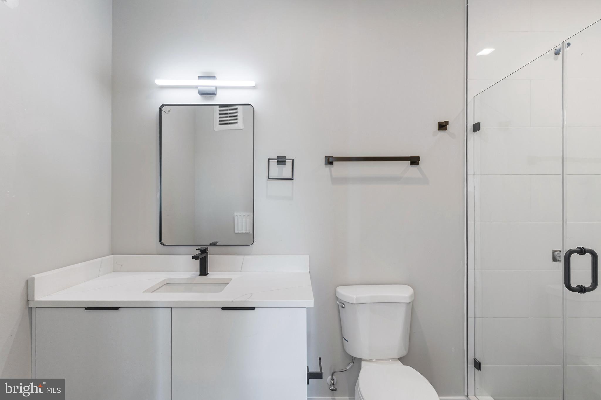 1358 Florida Avenue Northeast, Unit 207 Washington, DC 20002 - Photo 6 of 15 a bathroom with a sink a toilet and shower