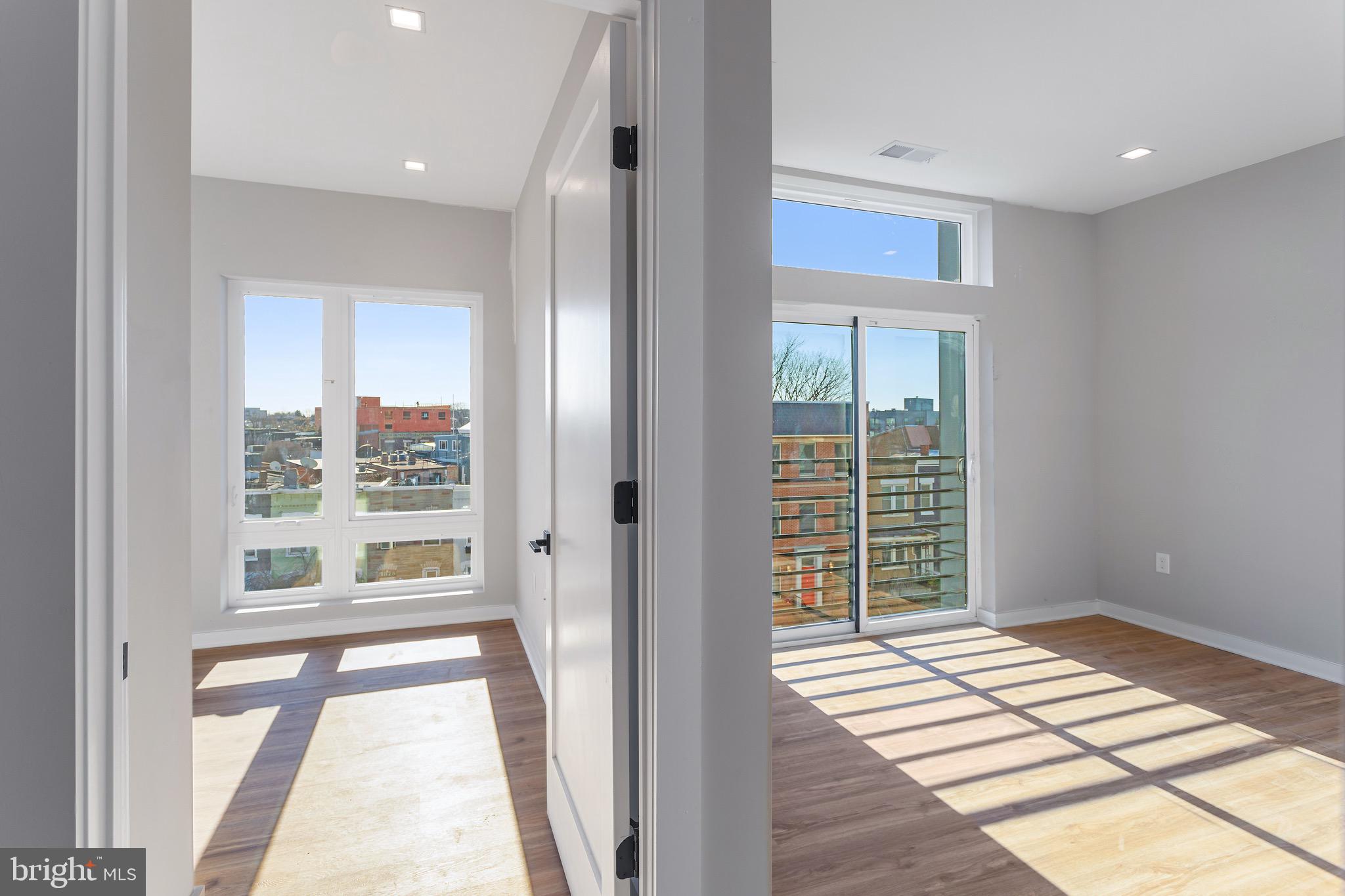 1358 Florida Avenue Northeast, Unit 207 Washington, DC 20002 - Photo 8 of 15 a view of wooden floor and windows in a room