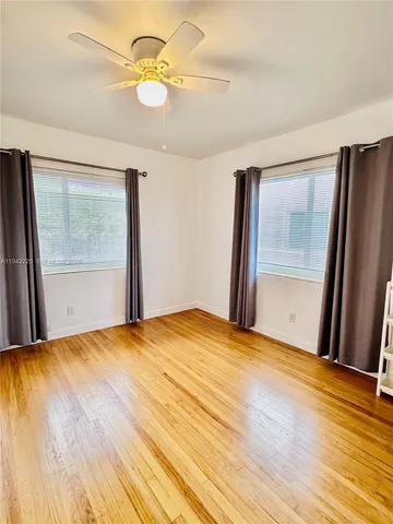 a bathroom with a sink a mirror and a shower