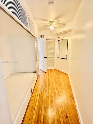 a view of room with wooden floor