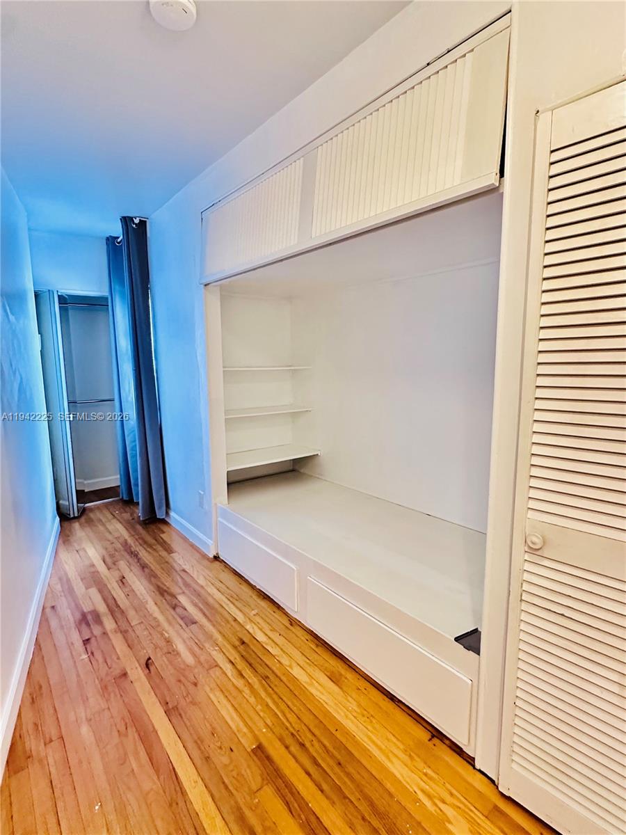 1180 Southwest 22nd Terrace, Unit 1 Miami, FL 33129 - Photo 30 of 32 a view of room with wooden floor