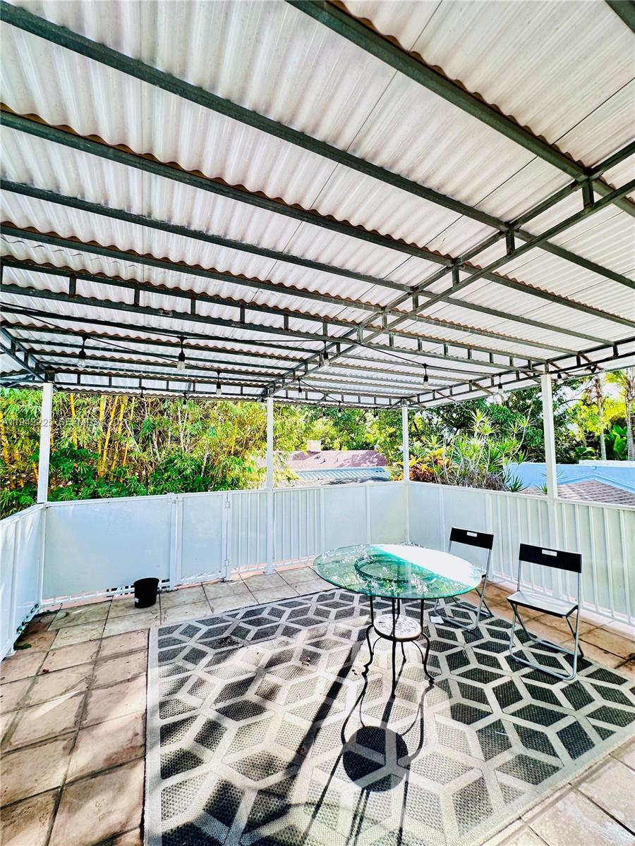 1180 Southwest 22nd Terrace, Unit 1 Miami, FL 33129 - Photo 4 of 32 a view of an outdoor space with sitting space