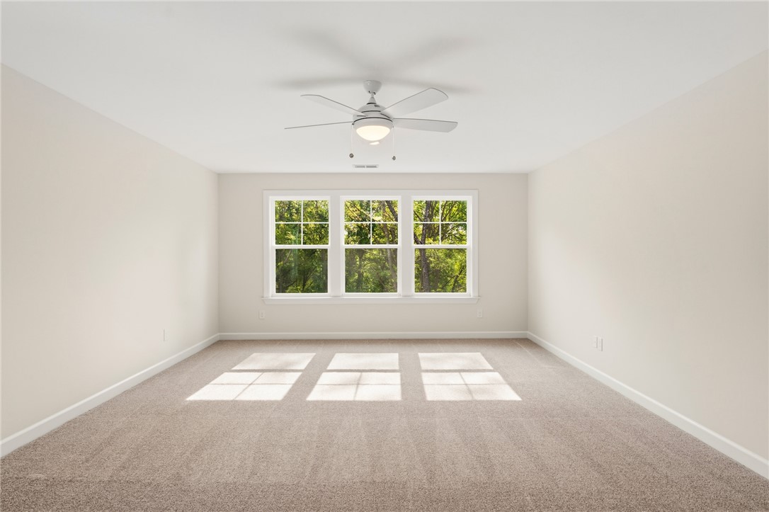 1108 Manse Jolly Road Anderson, SC 29621 - Photo 31 of 45 This spacious room offers natural light and comfortable carpet flooring, creating a serene ambiance.