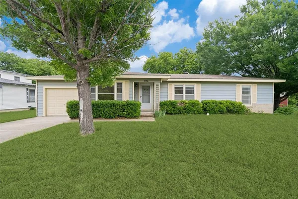 a house view with a garden space