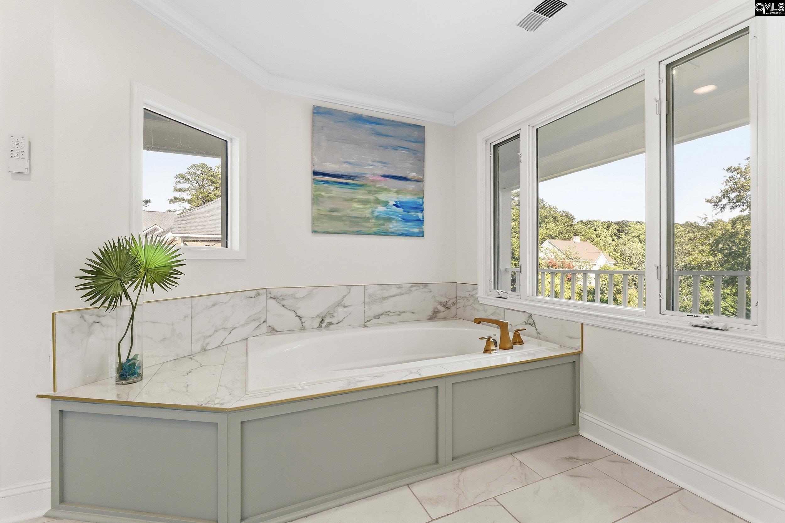 121 Silver Lake Road East Columbia, SC 29223 - Photo 43 of 57 a bathroom with a tub a sink and a window