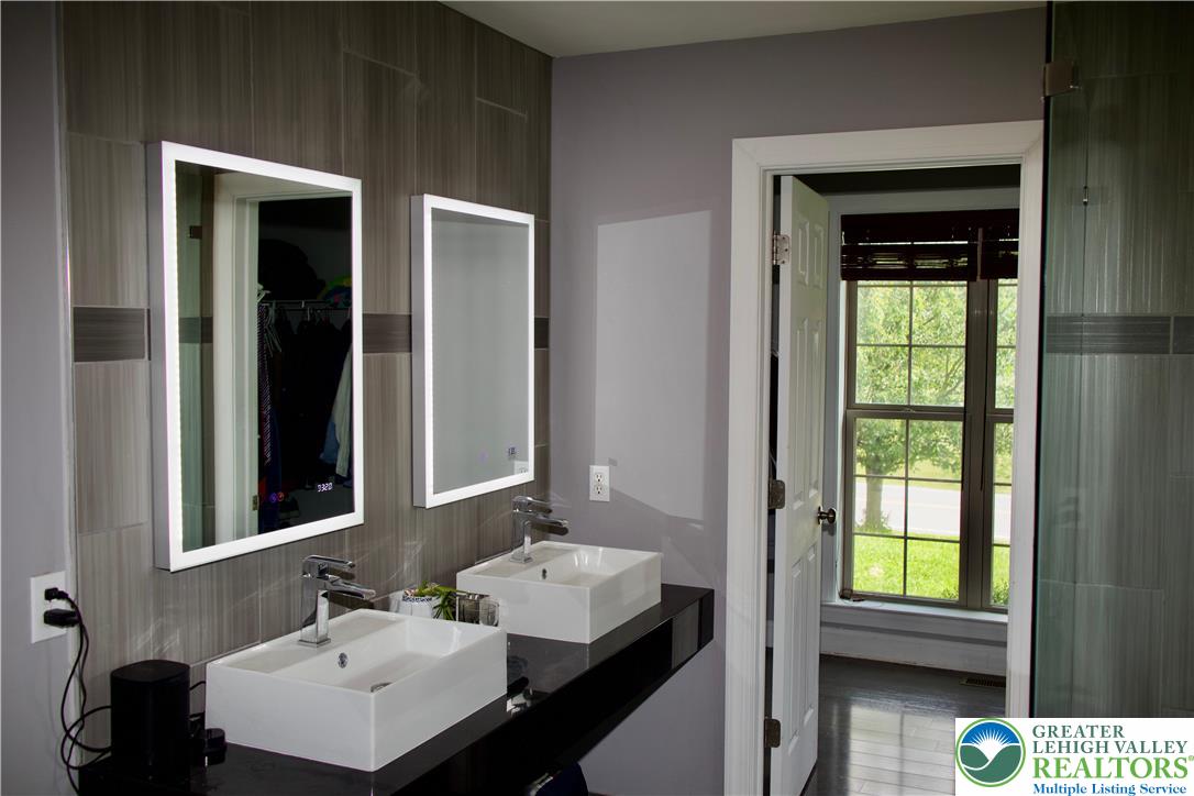 101 Cider Mill Road Mertztown, PA 19539 - Photo 7 of 26 a bathroom with a sink and a mirror