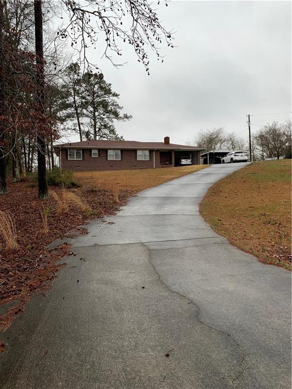 1005 Rocky Branch Road Villa Rica, GA 30180 - Photo 1 of 1 Front of home from street. Has circular drive way. Lots of parking