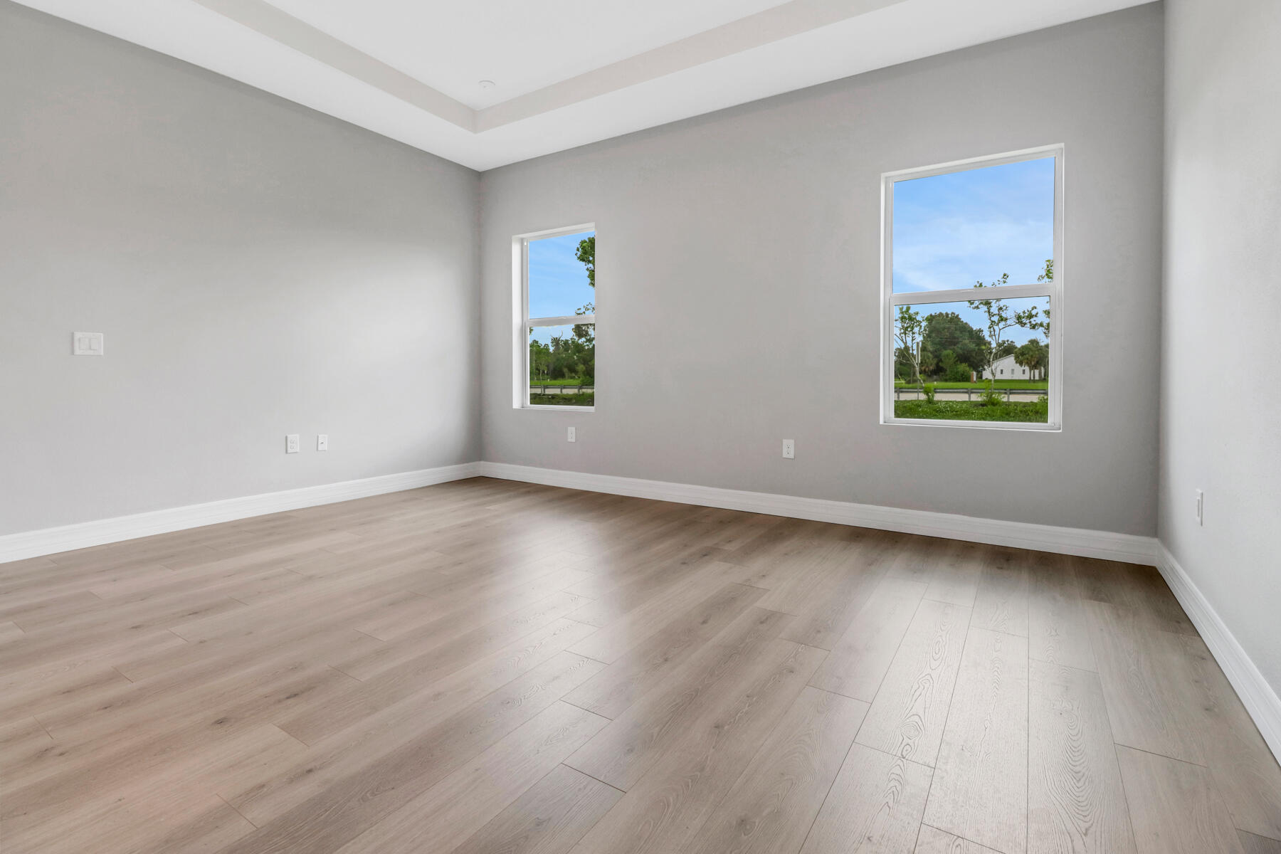 23158 Ranger Avenue Port Charlotte, FL 33954 - Photo 14 of 25 an empty room with wooden floor and window