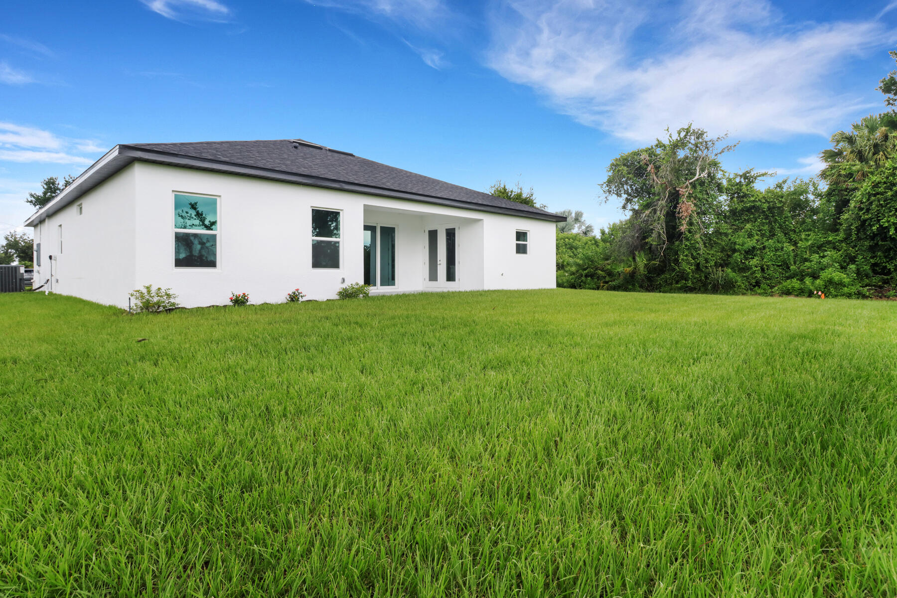 23158 Ranger Avenue Port Charlotte, FL 33954 - Photo 23 of 25 a front view of a house with garden