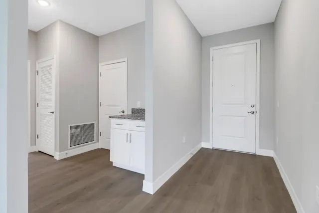 a view of cabinets and wooden floor