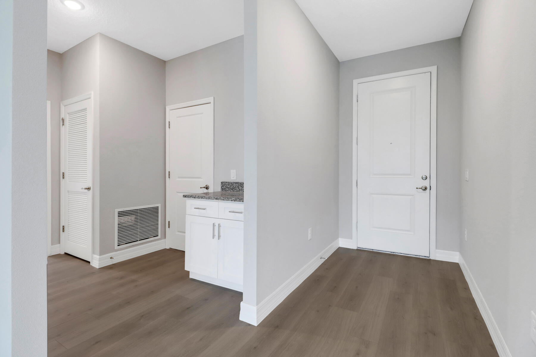 23158 Ranger Avenue Port Charlotte, FL 33954 - Photo 7 of 25 a view of cabinets and wooden floor