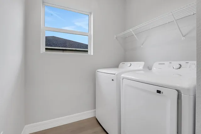 a utility room with dryer and washer