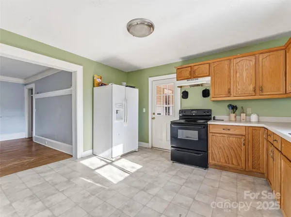 a kitchen with stainless steel appliances granite countertop a cabinets and a counter top space