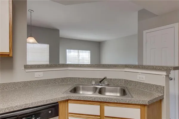 a kitchen with a stove microwave and sink