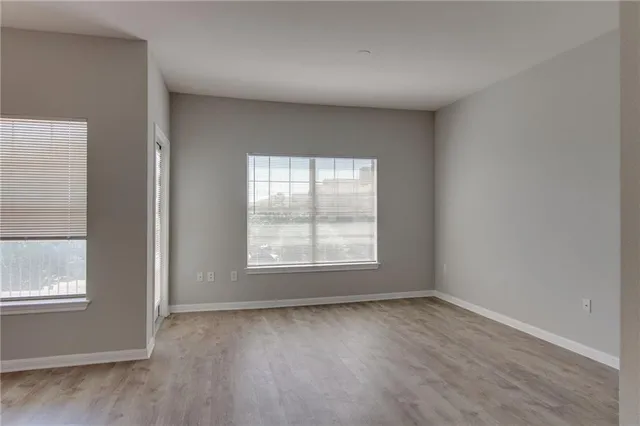 a view of hallway with wooden floor