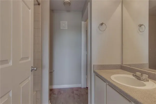 a bathroom with a sink and a mirror