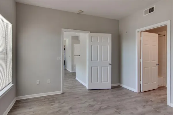 a view of an empty room and window
