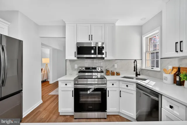 a kitchen with a stove and a microwave