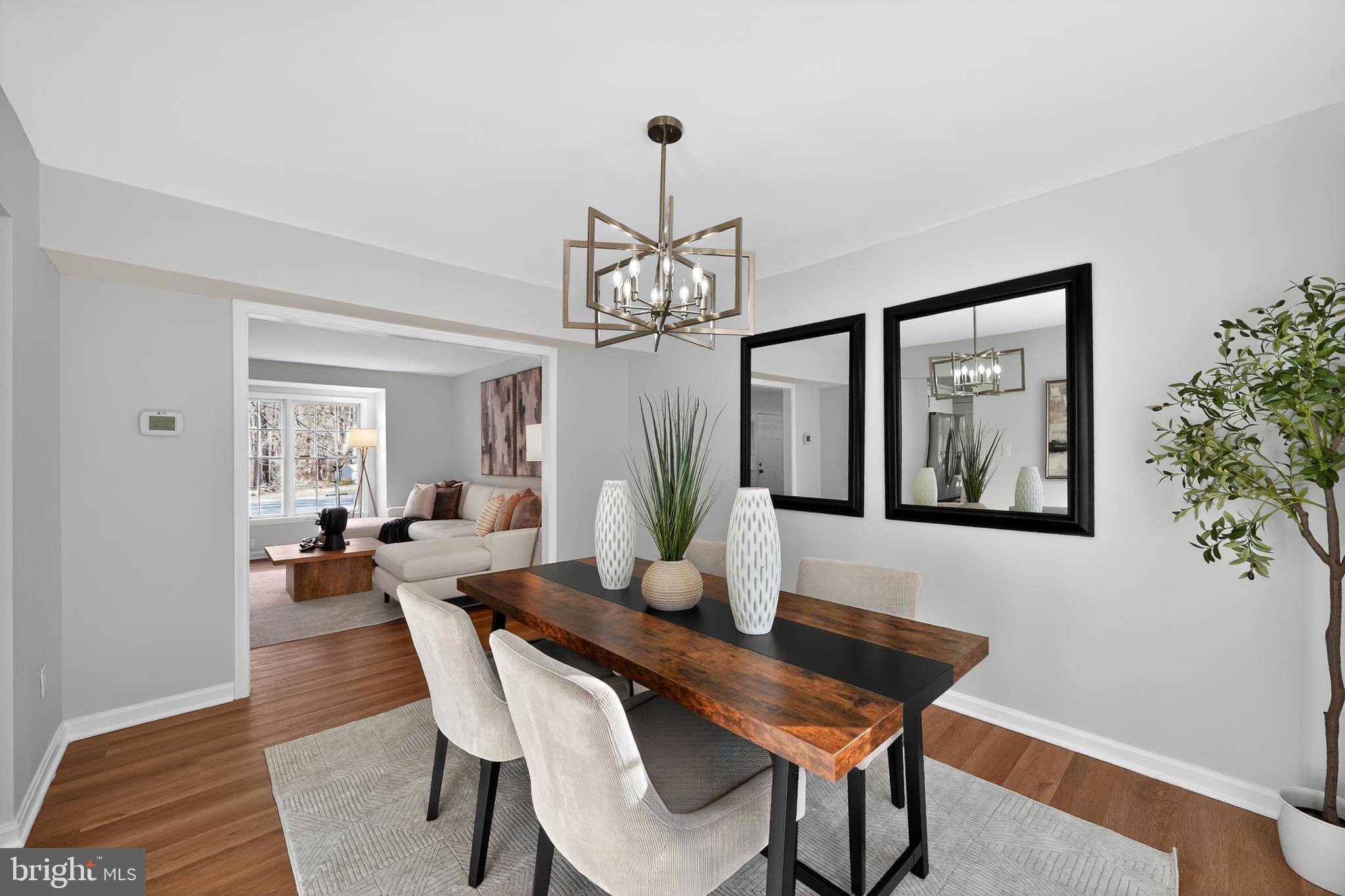 9310 Bellbeck Road Baltimore, MD 21234 - Photo 15 of 30 a view of a dining room with furniture window and wooden floor