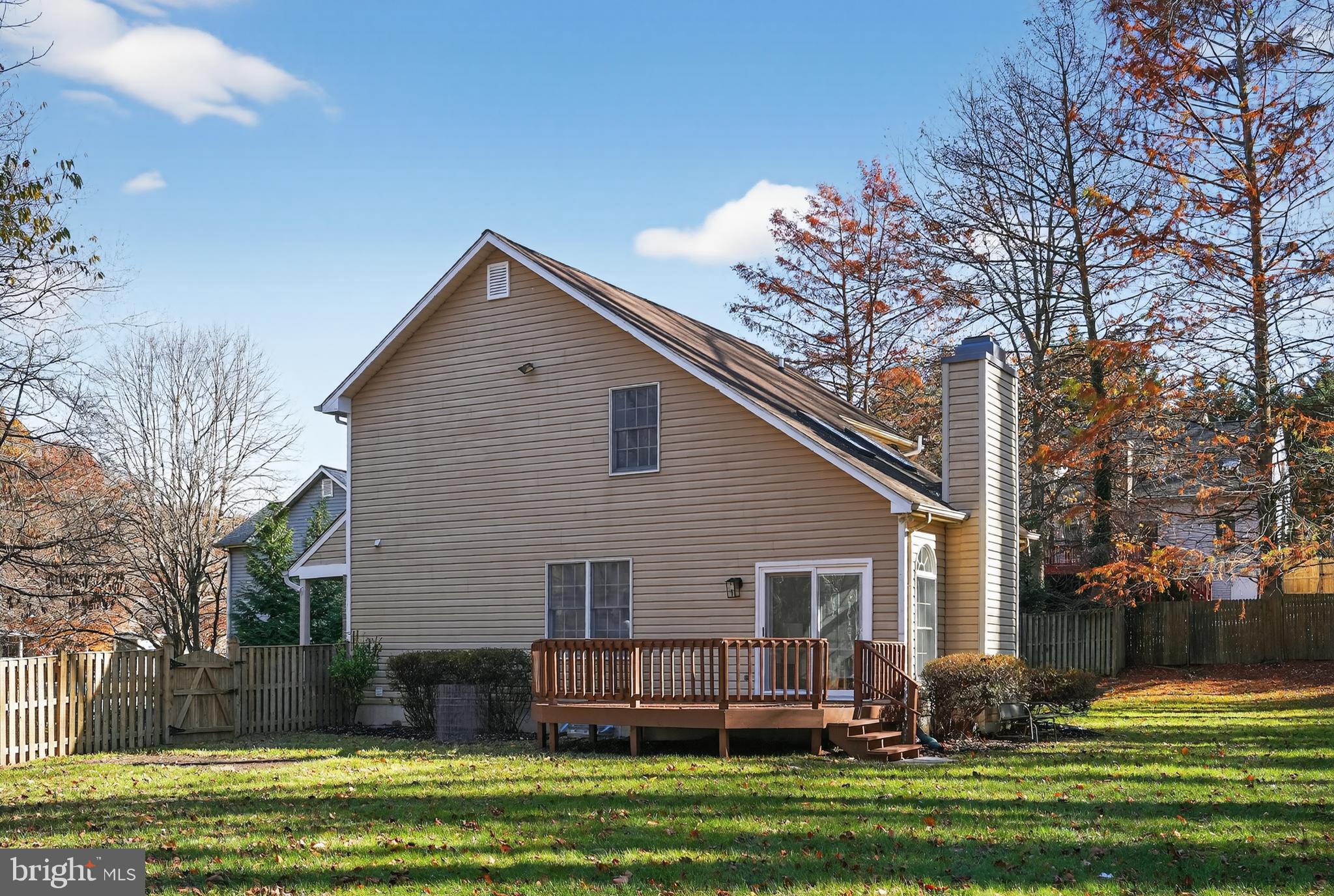 9310 Bellbeck Road Baltimore, MD 21234 - Photo 29 of 30 a front view of a house with a garden and trees