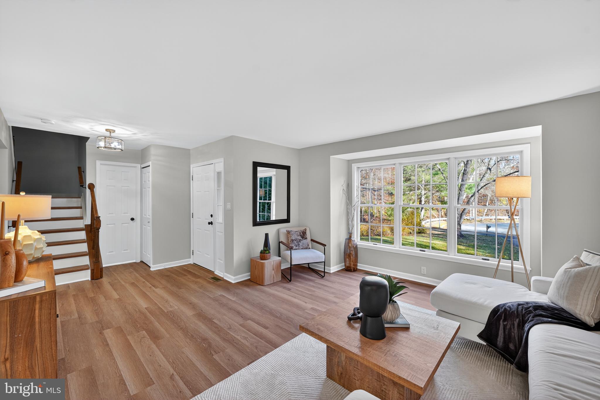 9310 Bellbeck Road Baltimore, MD 21234 - Photo 8 of 30 a bedroom with furniture and a large window