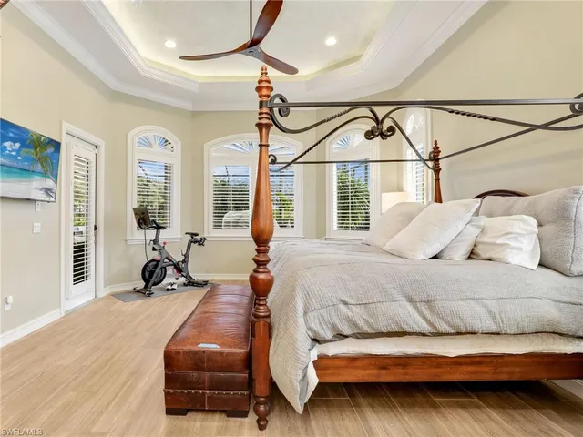 a bedroom with a bed window and couch