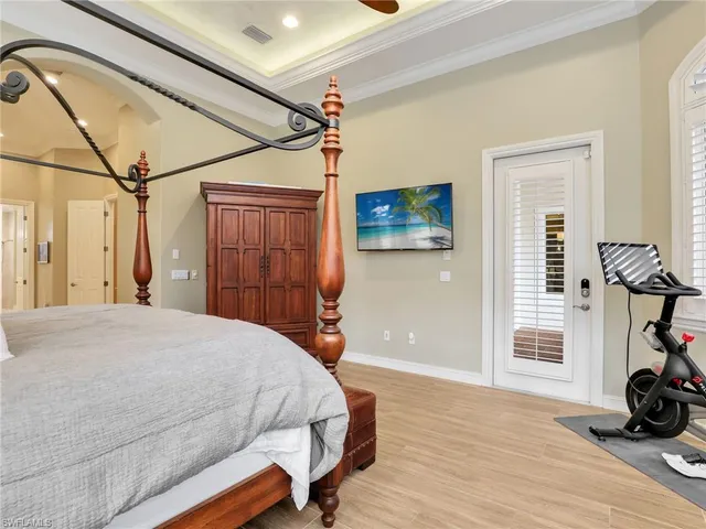 a bedroom with a bed window and a walk in closet