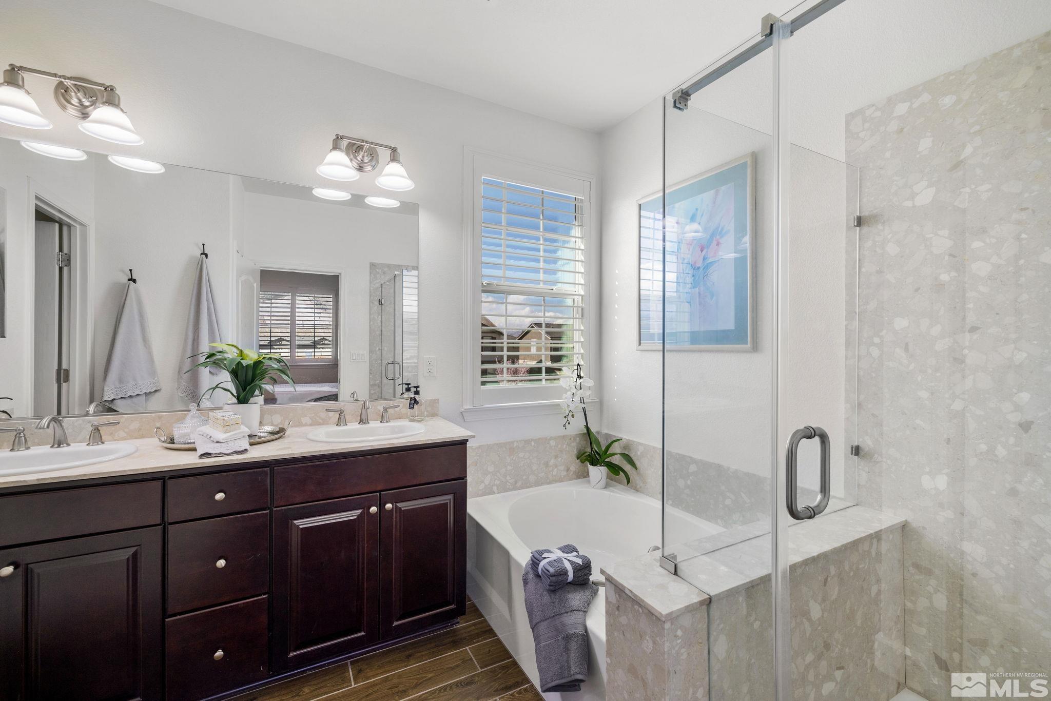 10656 Foxberry Park Drive Reno, NV 89521 - Photo 18 of 31 a bathroom with a double vanity sink mirror and double
