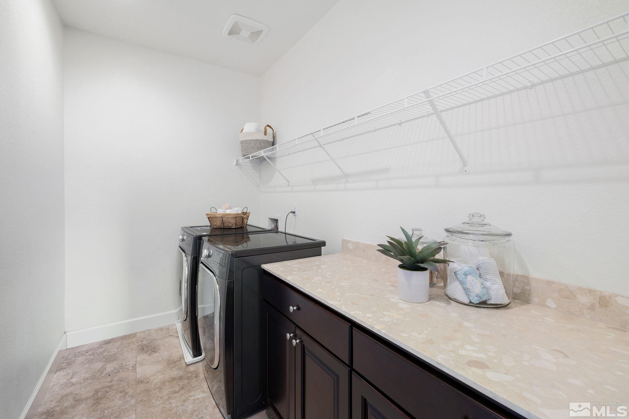 10656 Foxberry Park Drive Reno, NV 89521 - Photo 23 of 31 a kitchen with a sink and a refrigerator