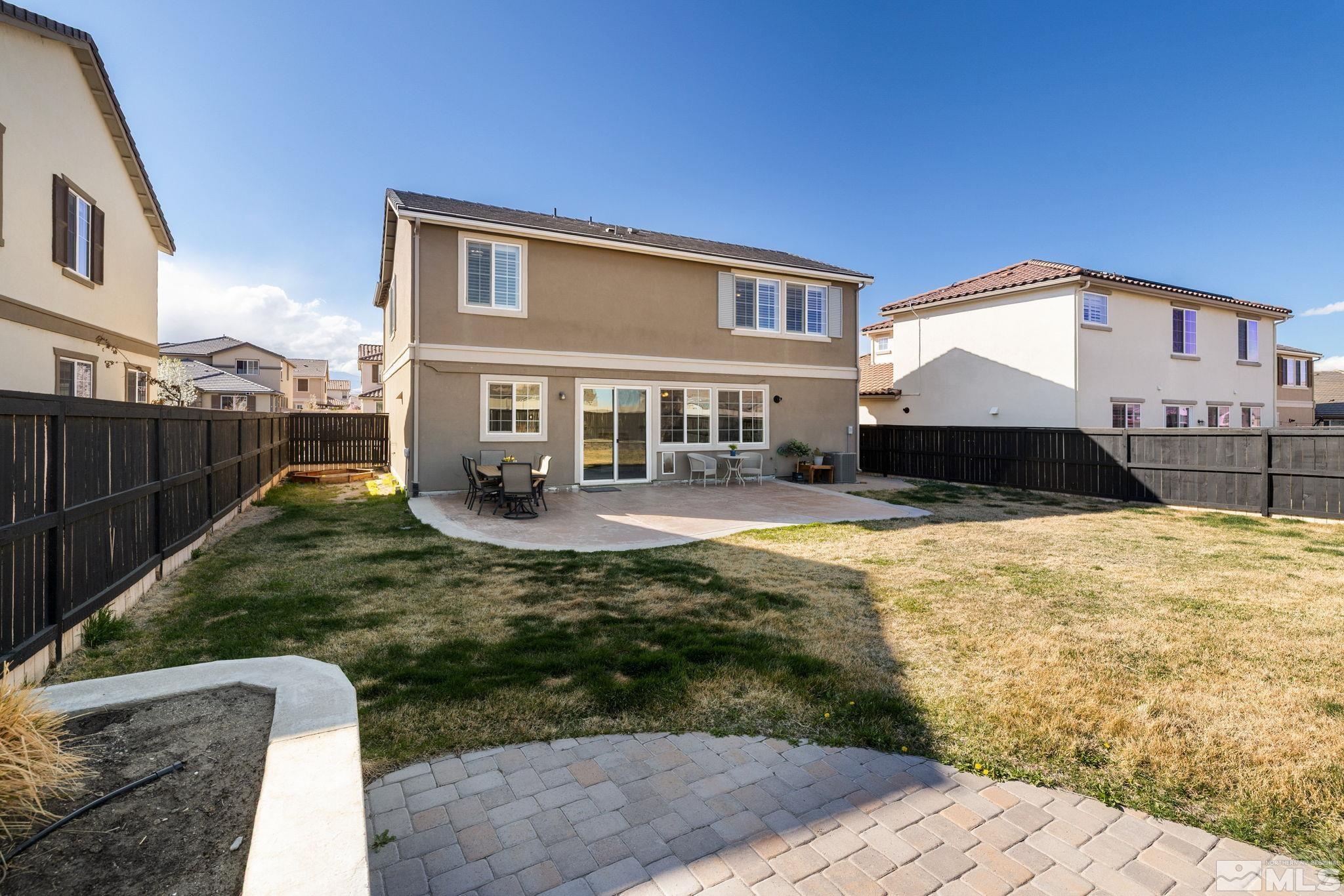 10656 Foxberry Park Drive Reno, NV 89521 - Photo 24 of 31 a front view of a house with a yard