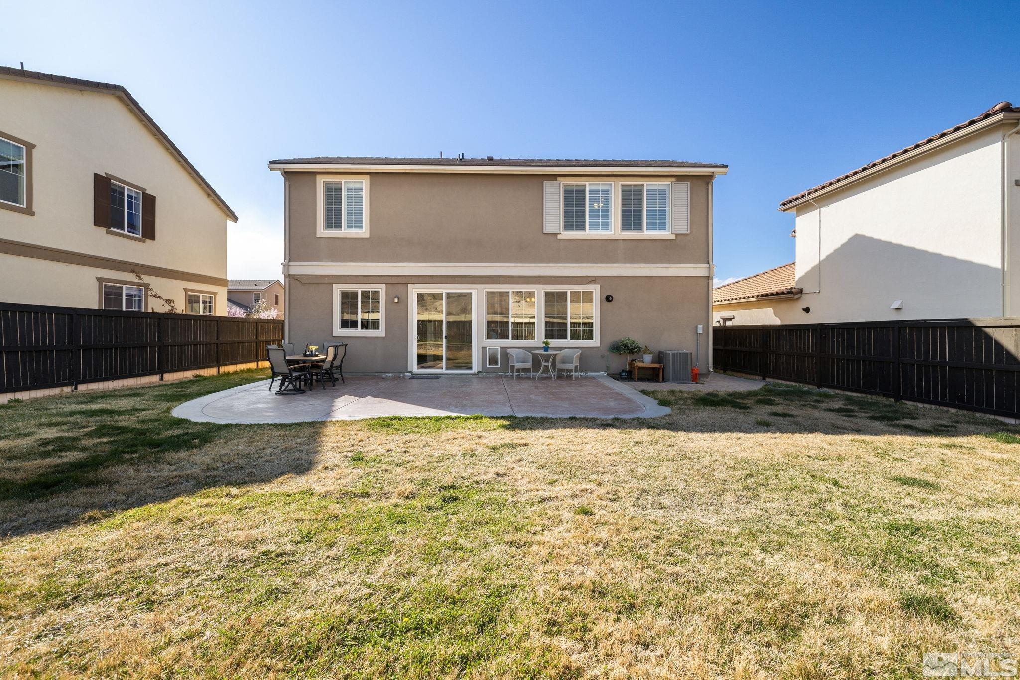 10656 Foxberry Park Drive Reno, NV 89521 - Photo 25 of 31 a view of a house with a yard
