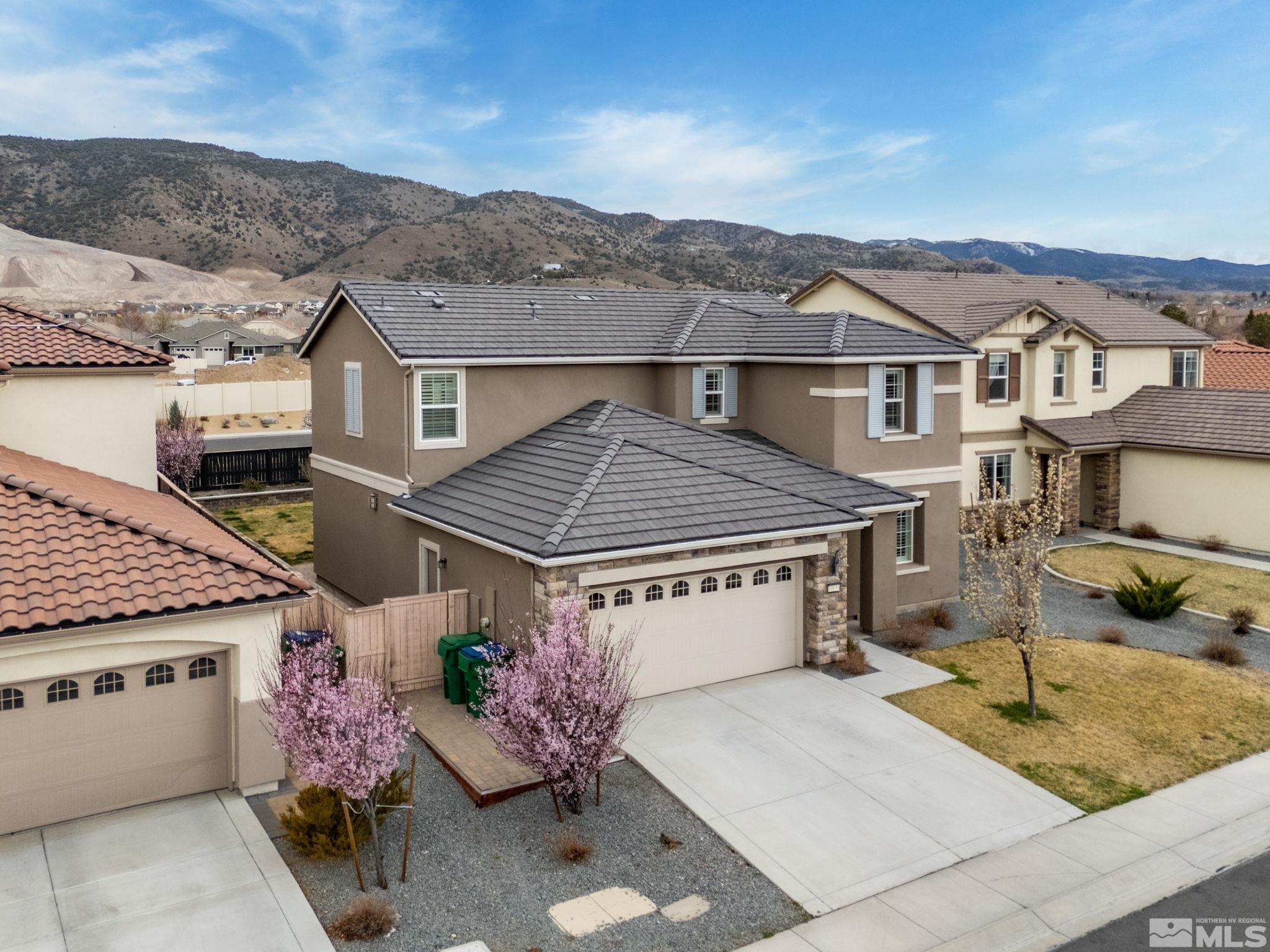 10656 Foxberry Park Drive Reno, NV 89521 - Photo 30 of 31 a view of a house with a tub and a yard