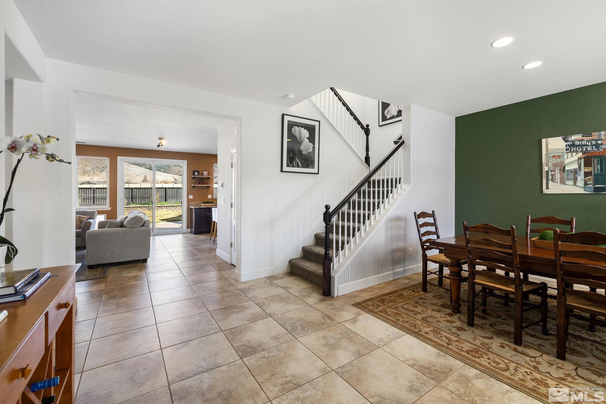 10656 Foxberry Park Drive Reno, NV 89521 - Photo 4 of 31 a living room with furniture and a floor to ceiling window
