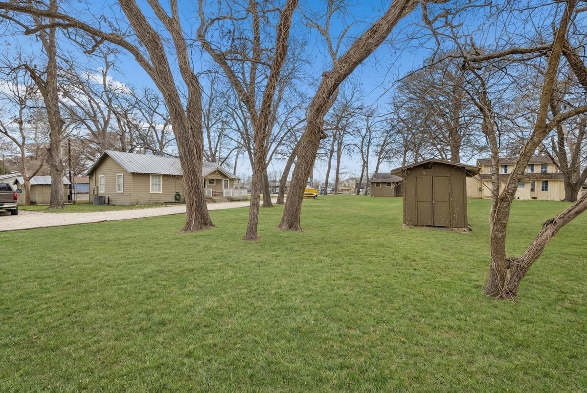 1307 Terminal Loop Road McQueeney, TX 78123 - Photo 17 of 23 a backyard of a house with lots of green space