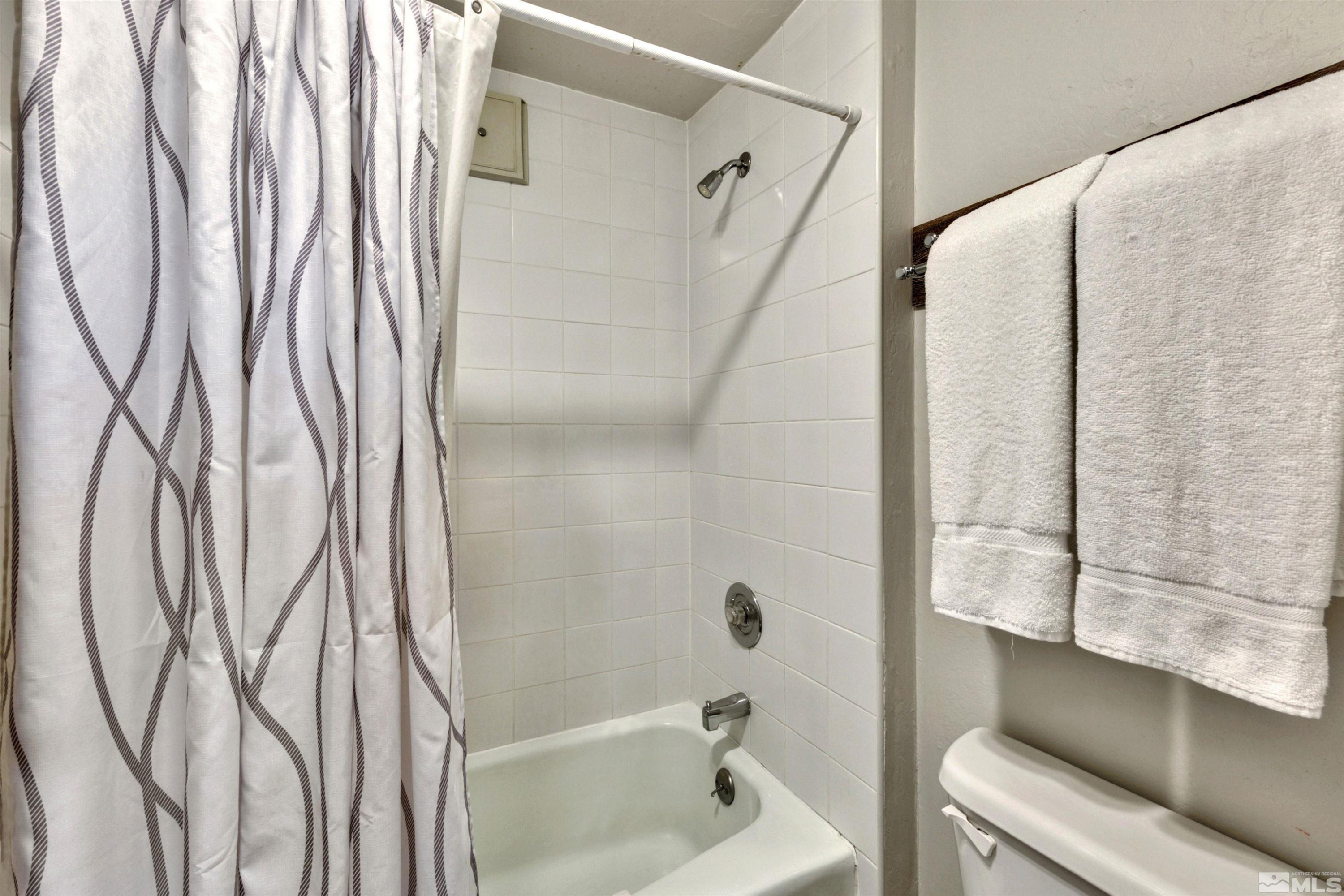 46 Chalet Court Stateline, NV 89449 - Photo 20 of 30 a bathroom with a bathtub and a shower