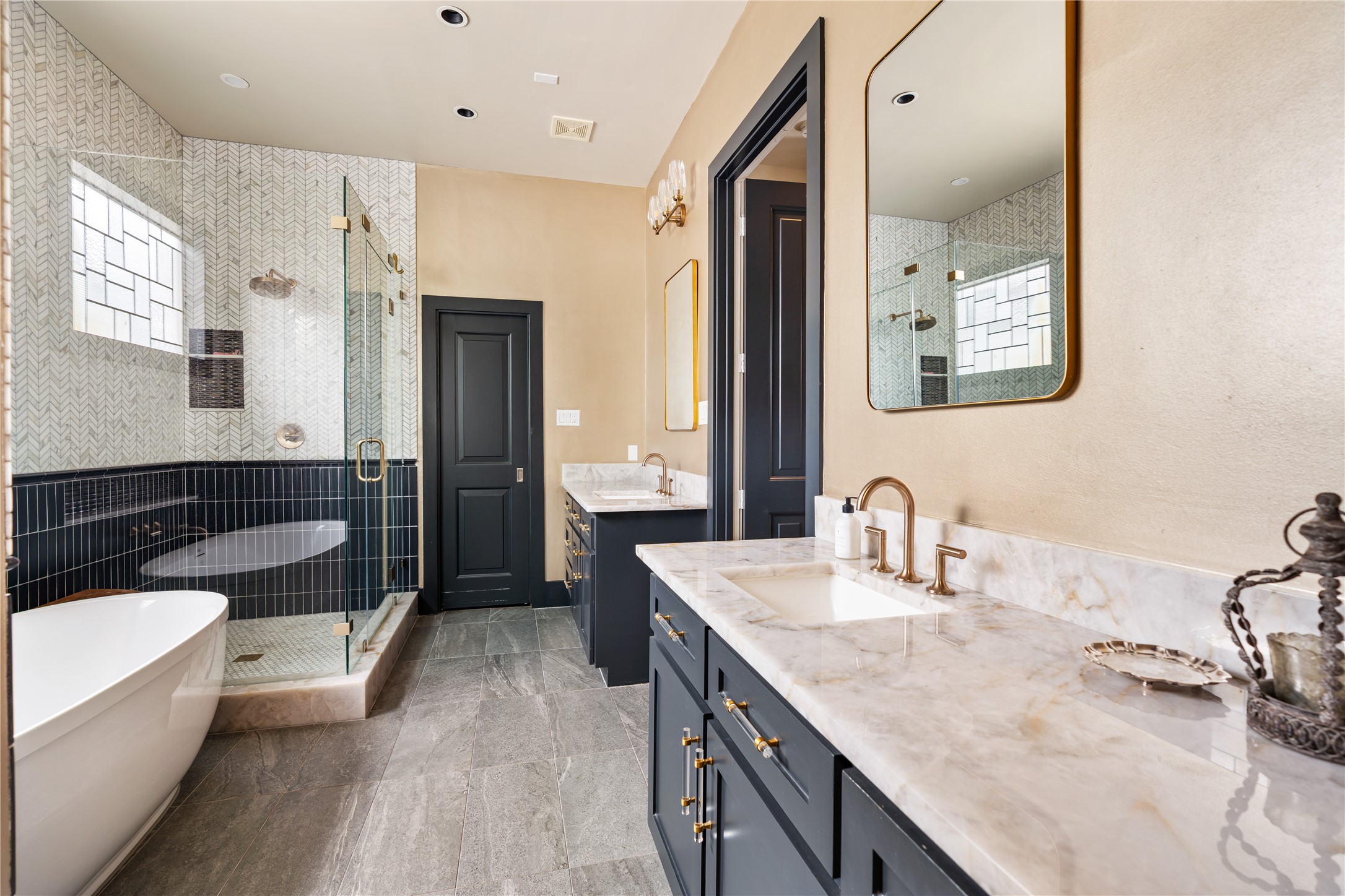 926 Nicholson Street Houston, TX 77008 - Photo 22 of 36 Expansive separate vanities offer generous storage and counter space, blending everyday practicality with refined design.