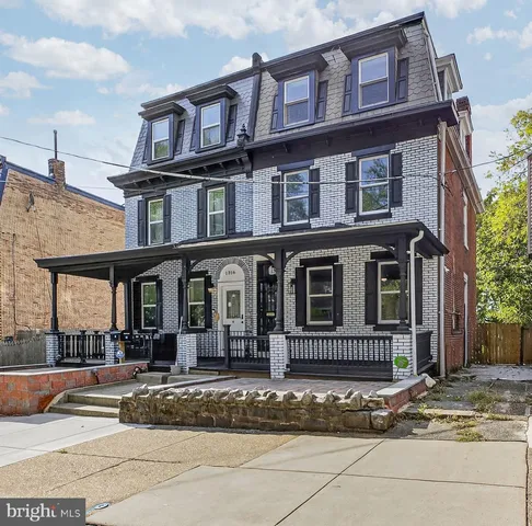 a view of a building with a yard