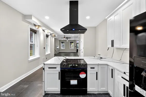 a kitchen with a stove and a refrigerator