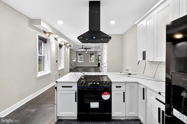 a kitchen with a stove and a refrigerator