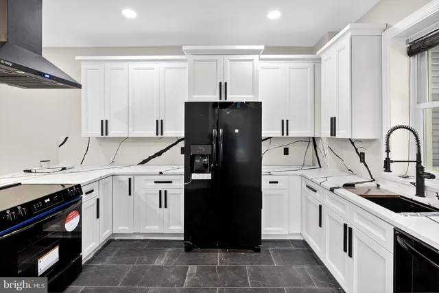a kitchen with a sink stove and refrigerator