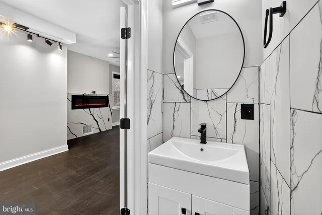 a bathroom with a sink and a mirror