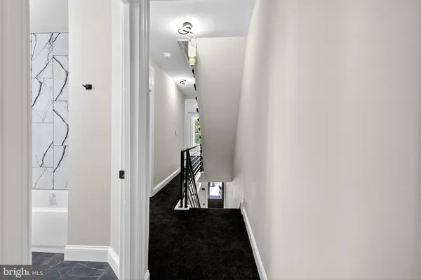 a view of a hallway with a flower pot