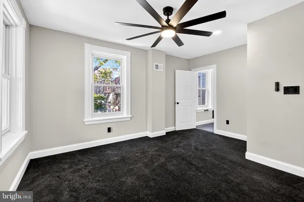 a view of an empty room with a window